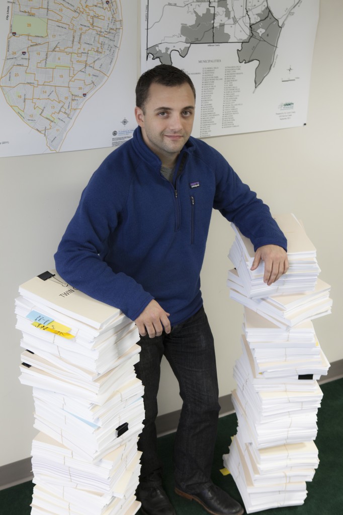 (Better Together staffer with municipal ordinances from the 90 municipalities in St. Louis County)